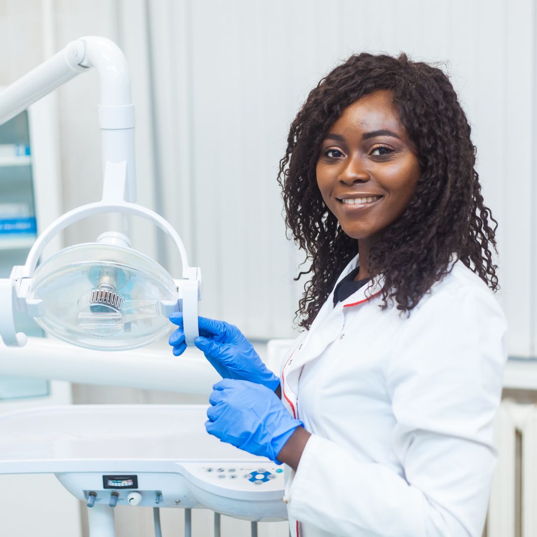 Dental Assistant preparing equipment