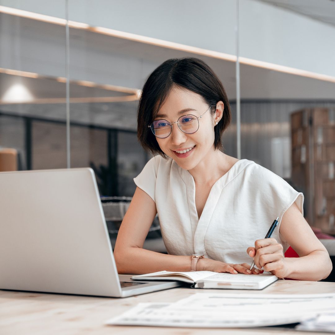 Instructional designer leans in toward her laptop