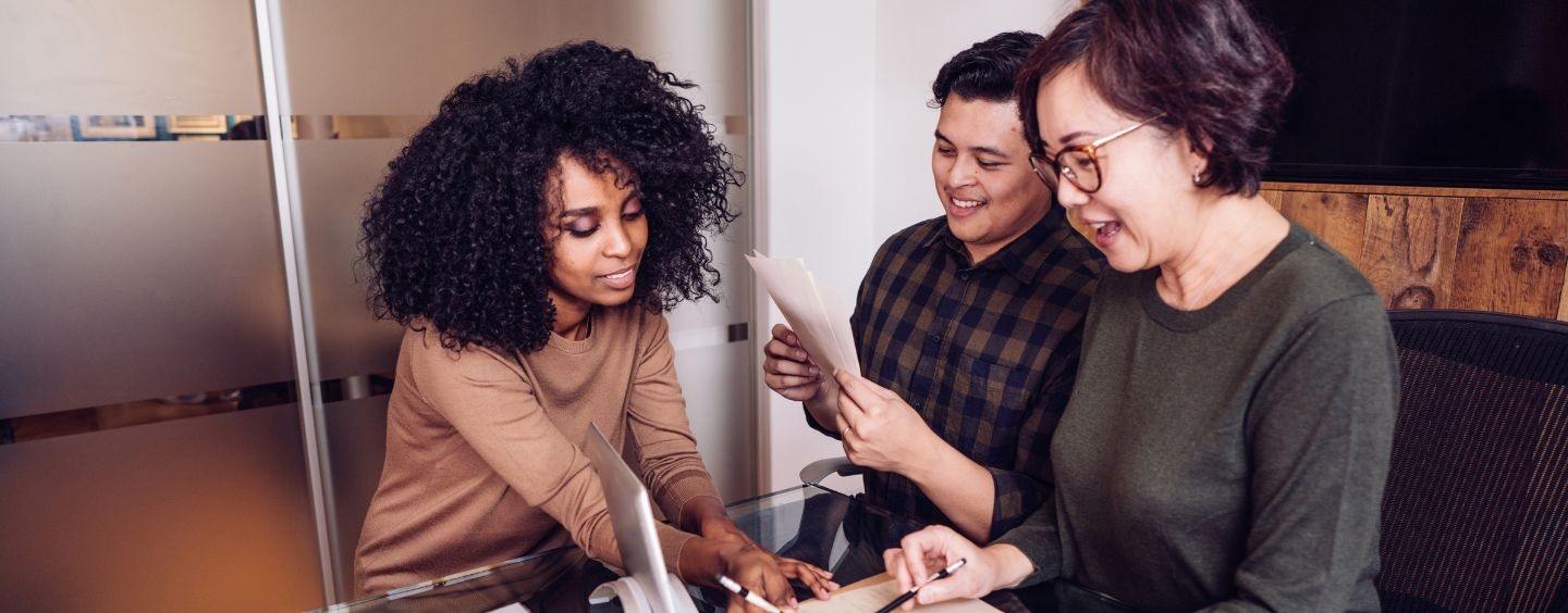 Three people working together