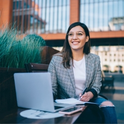 Business student taking her online class outside