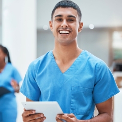 Medical assistant in scrubs at work