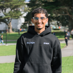 Student in a hoodie on campus at SFSU