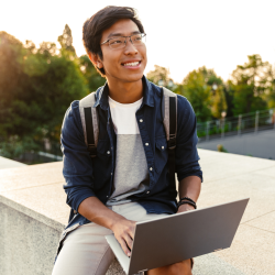 Open University student taking an online course outside