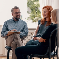 Psychologist in a group therapy session