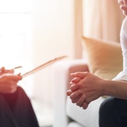 Psychologist and patient hands