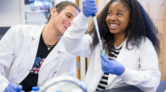 Clinical lab scientists working together in the lab